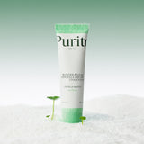 Purito Wonder Releaf Centella Cream 50ml i hvit tube med grønn topp mot snøaktig bakgrunn